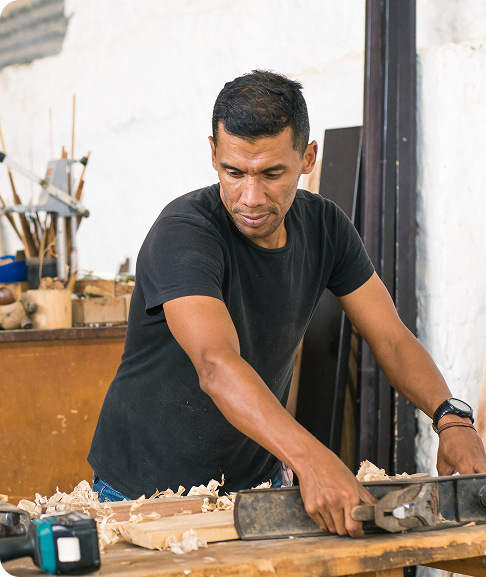 Work: Latin American worker in his workshop using different tools.